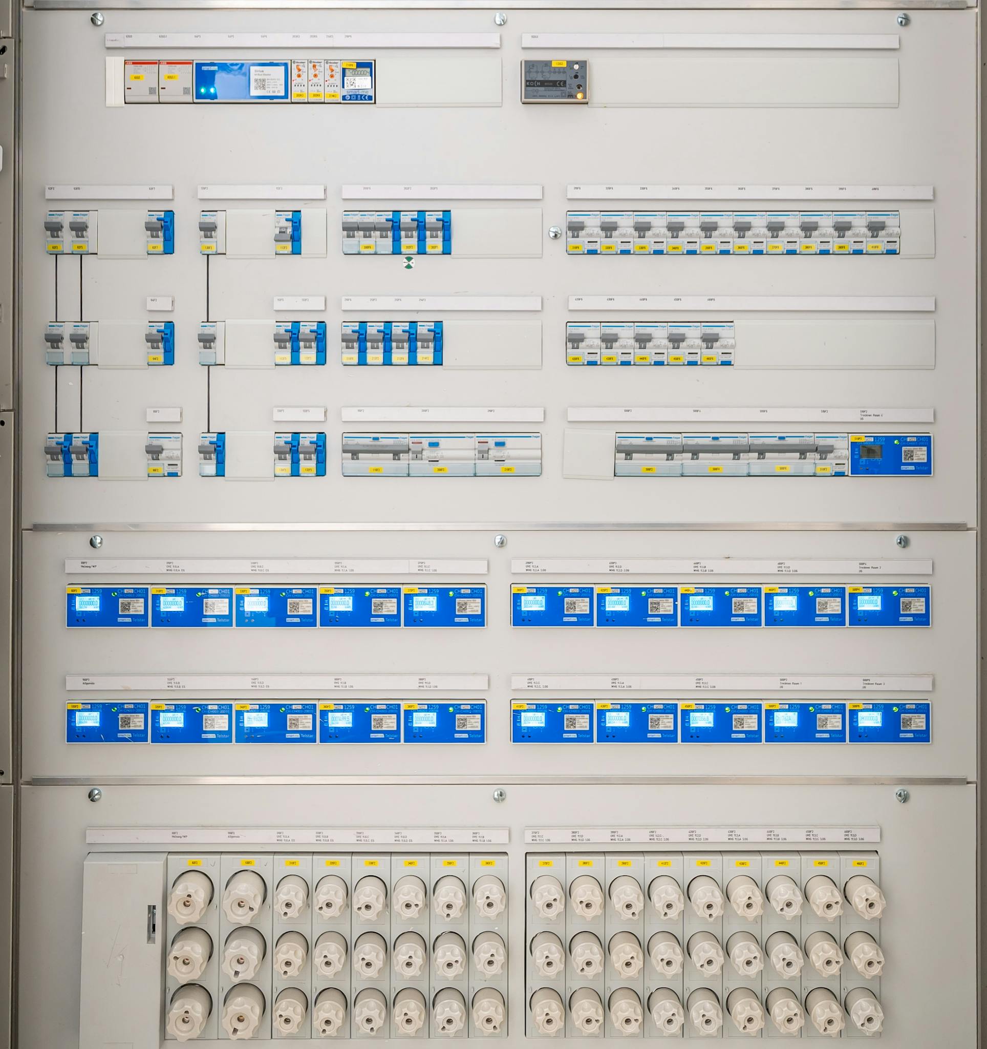 Detailed view of a modern electrical panel featuring circuit breakers and sockets for efficient energy distribution.